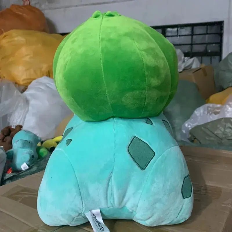 Plush toy of a Pokemon Sleeping Bulbasaur with round green head and blue body, 40CM