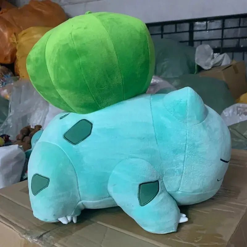 Plush toy of Bulbasaur, featuring a blue body and green bulb, Pokemon Sleeping Bulbasaur