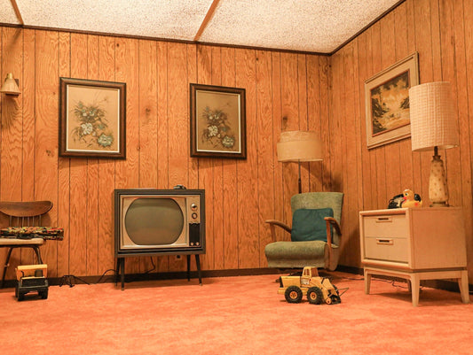 a living room with a television and a toy car