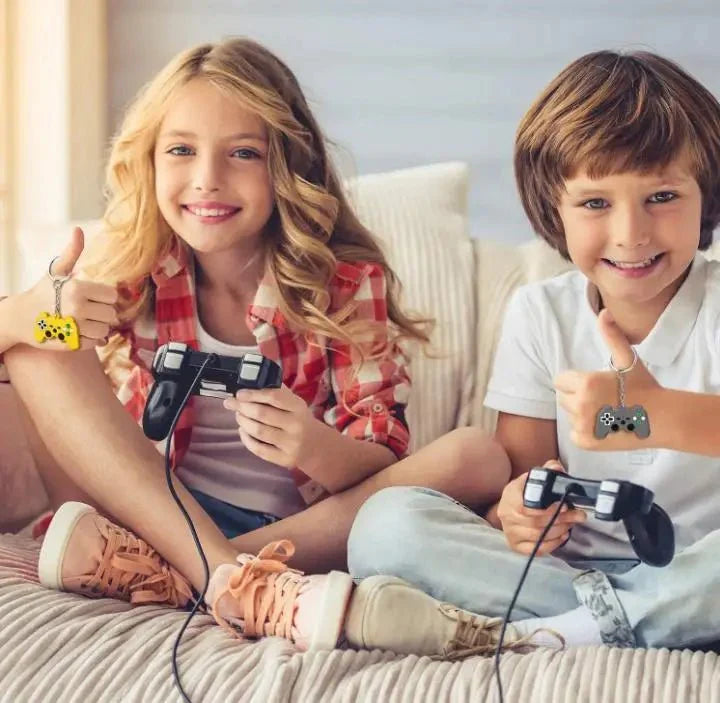 Two children enjoying game controller keychains while playing video games together