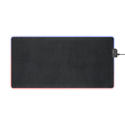 Black LED light-up mouse pad with USB cable on a white background