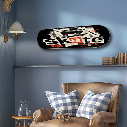 A skateboard wall art print featuring a graphic collage with the word 'skate' in white and orange, mounted on a blue wall above a brown armchair with blue-and-white gingham pillows.