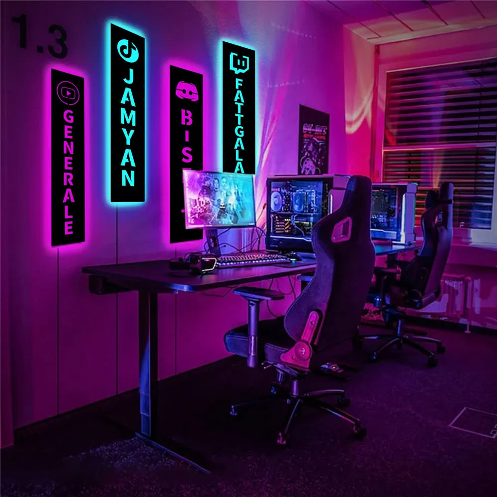 a gaming room with neon lights and a computer desk