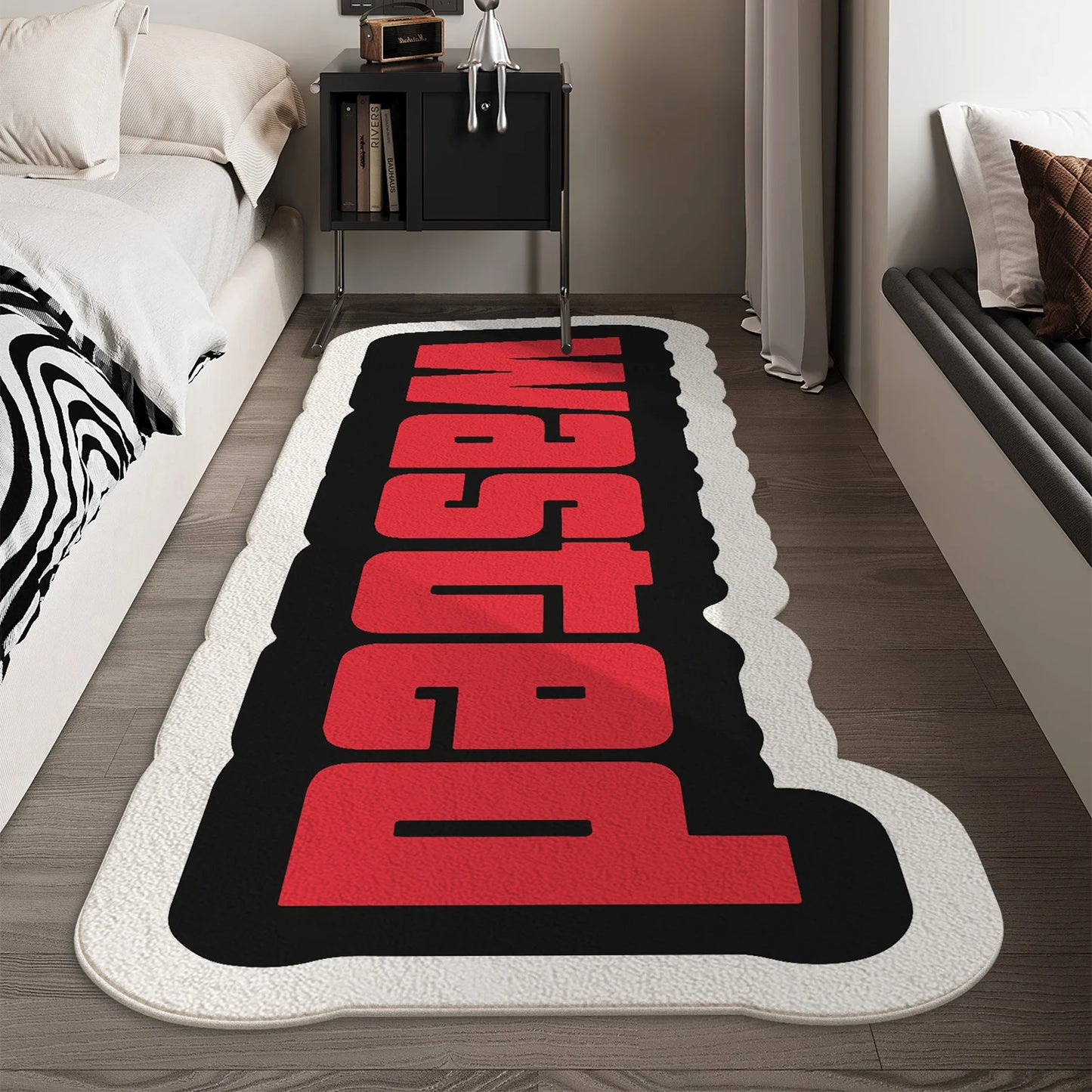 Decorative rug with red and black text in a bedroom setting