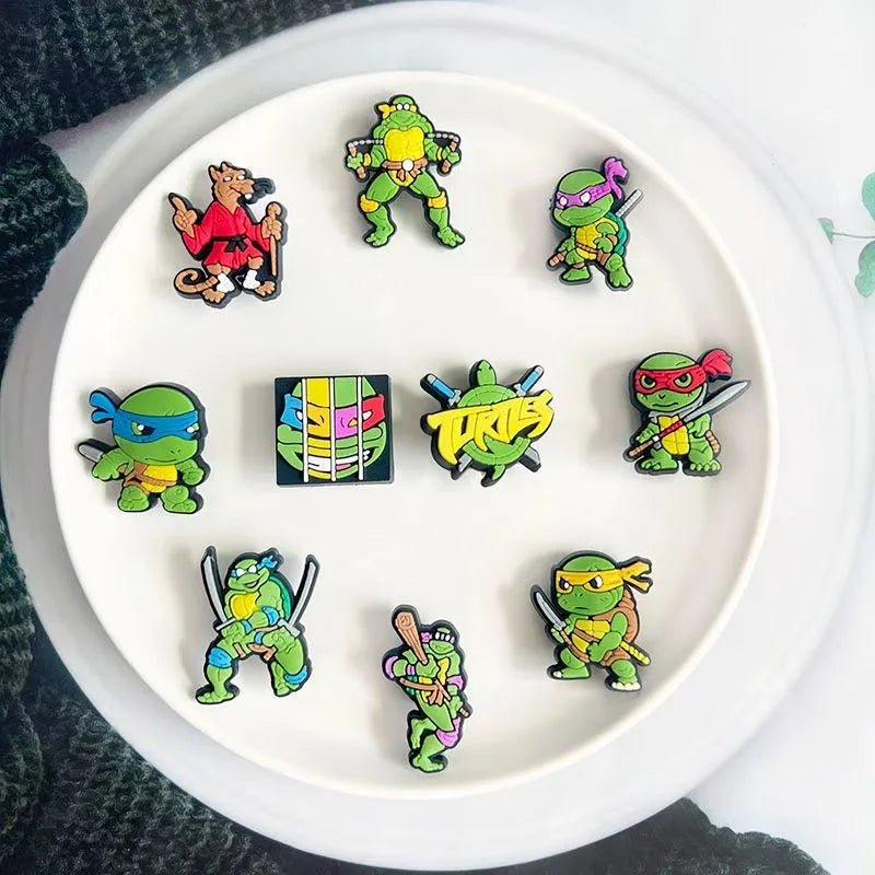 Collection of colorful cartoon turtle pins on a white plate.