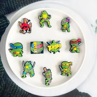 Collection of colorful cartoon turtle pins on a white plate.