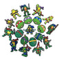 Collection of Teenage Mutant Ninja Turtle-themed pins on a white background