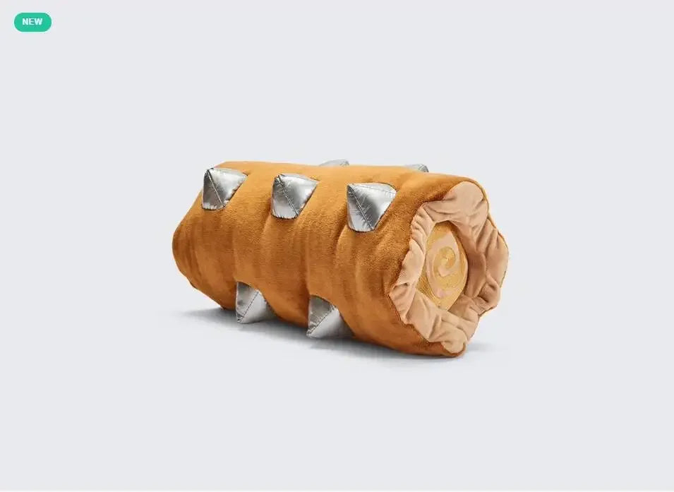 Toy resembling a log with spikes on a light gray background