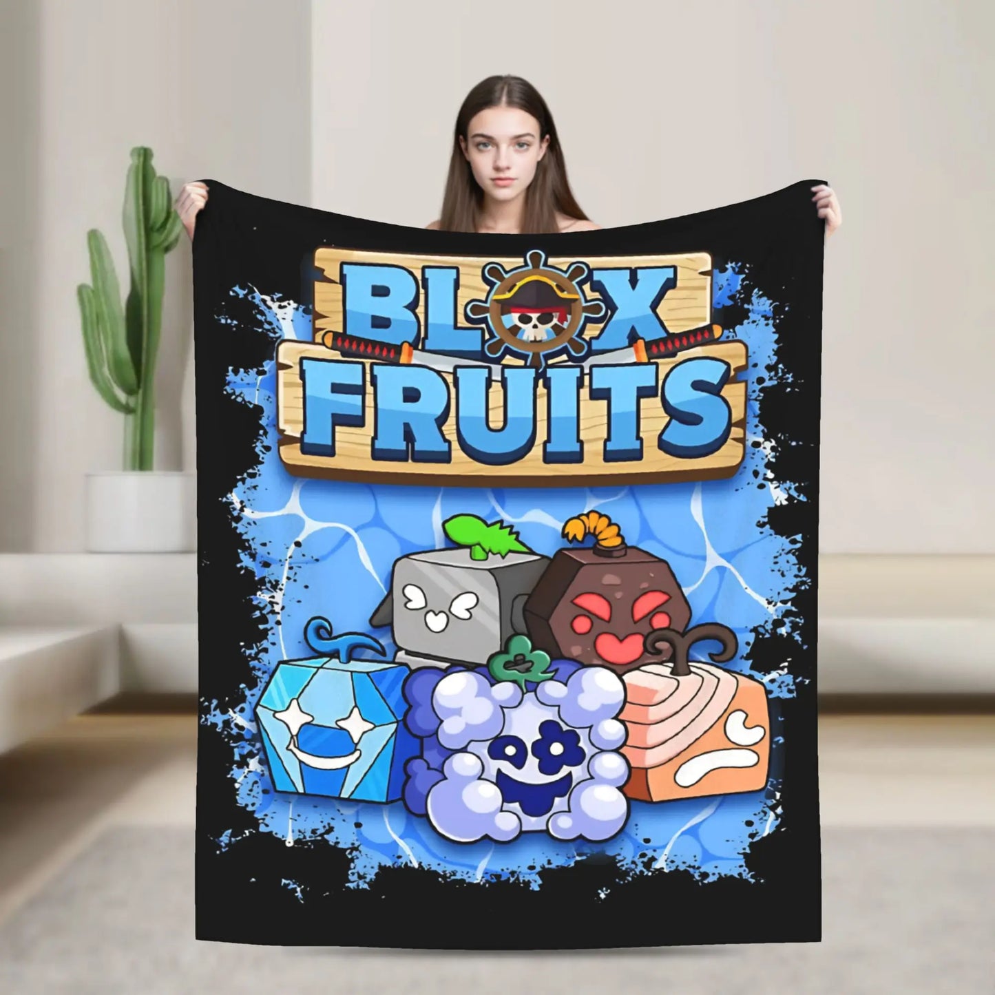 Person holding a 'Blox Fruits' blanket with colorful graphics on a neutral background