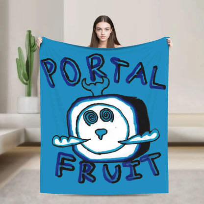 Person holding a blue blanket with 'Portal Fruit' design in a room with a cactus plant.