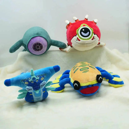 Four colorful plush toys on a white surface