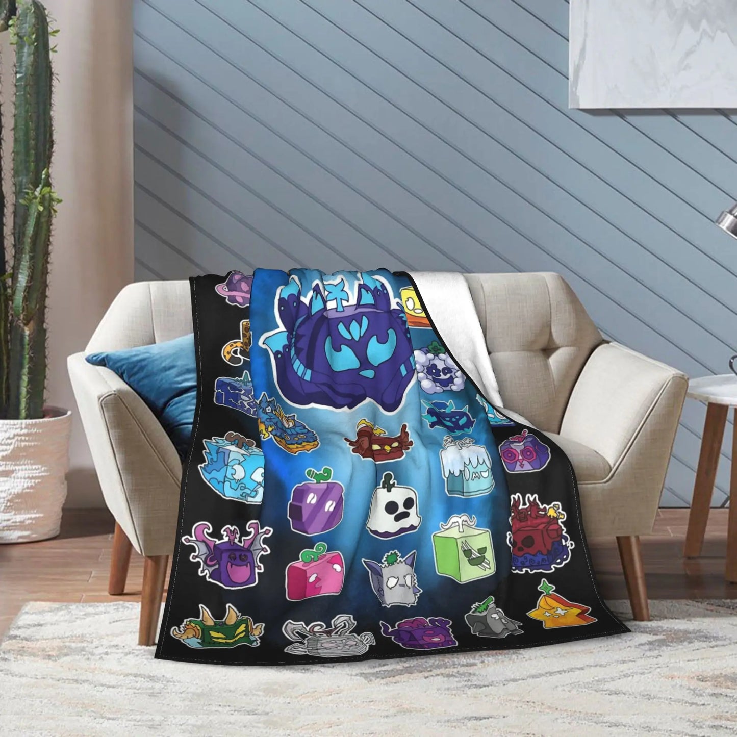 Colorful blanket with cartoon character designs draped over a sofa in a living room.