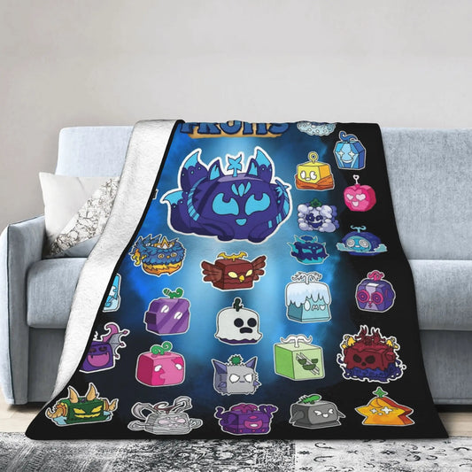 Colorful cartoon blanket with various characters on a gray couch.