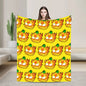 Person holding a large yellow towel with cartoon character pattern