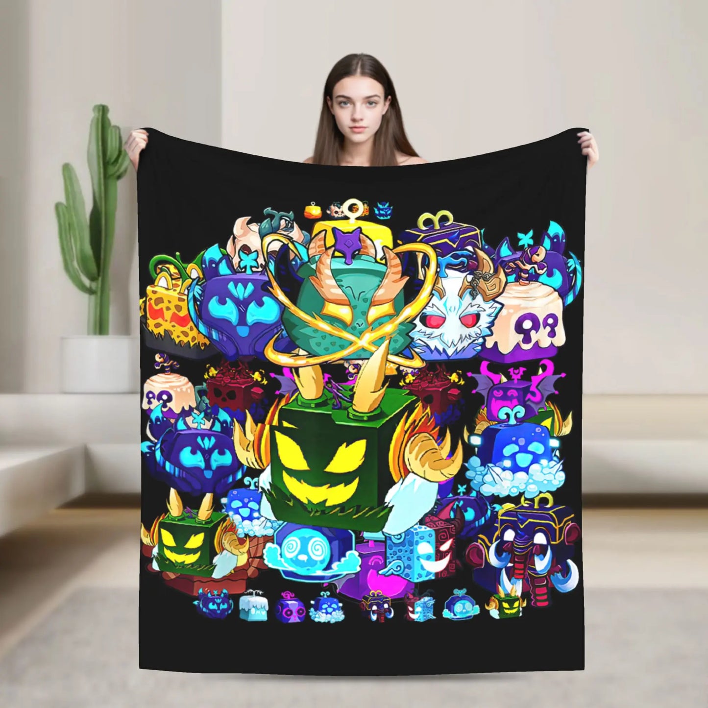Person holding a colorful blanket with cartoon characters on a plain background