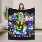 Person holding a colorful blanket with cartoon characters on a plain background