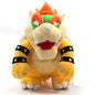 Plush toy resembling Bowser from Super Mario on a white background