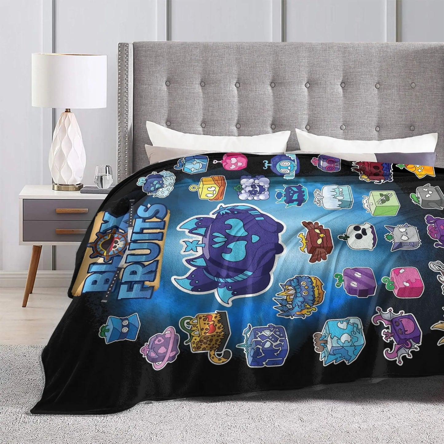 Bedding set with colorful character design on a bed in a bedroom setting.