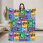 Person holding a colorful blanket with cartoon character patterns