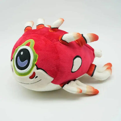 Plush toy resembling a stylized virus with red body, white legs, and black eye on a white background