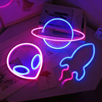two neon lights sitting on top of a table