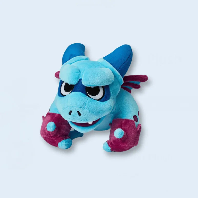 Blue and pink plush toy on a light gray background