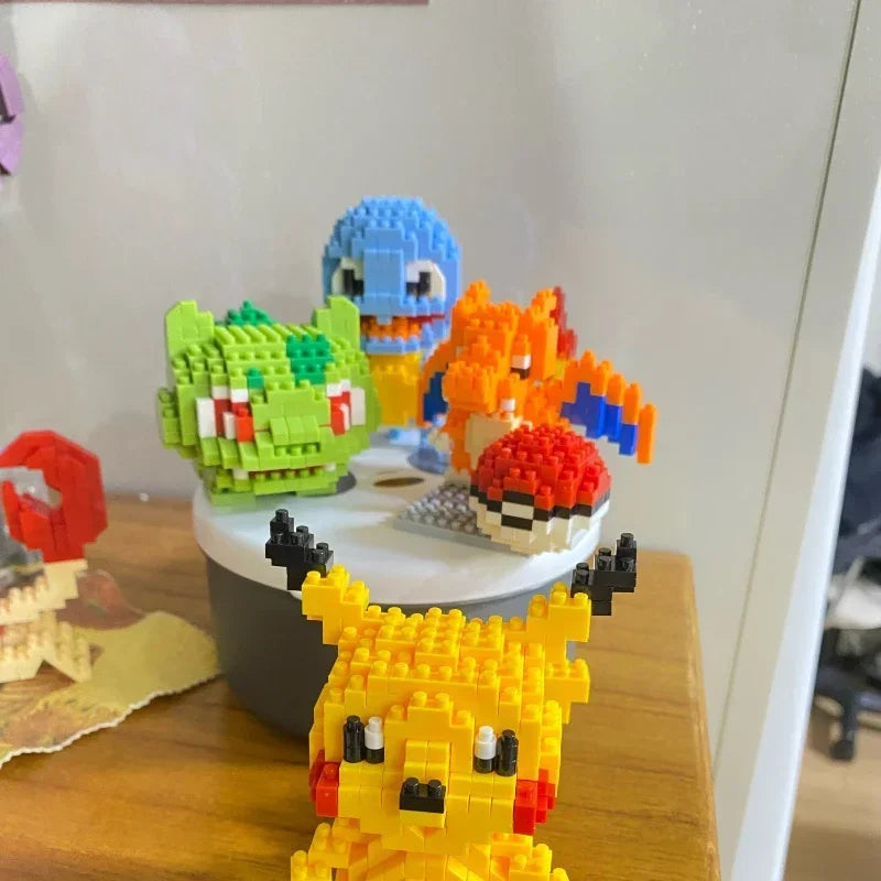 Pokemon Small Blocks Nanoblocks, featuring models of Charizard, Kyogre, Groudon, and Rayquaza, are educational and visually engaging toys, ideal for children's birthday presents.
