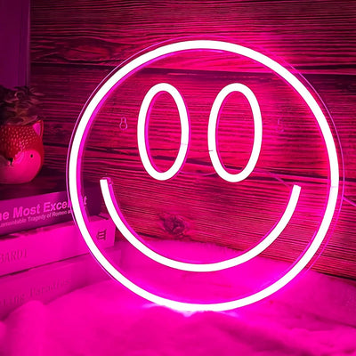 a neon sign with a smiley face on it
