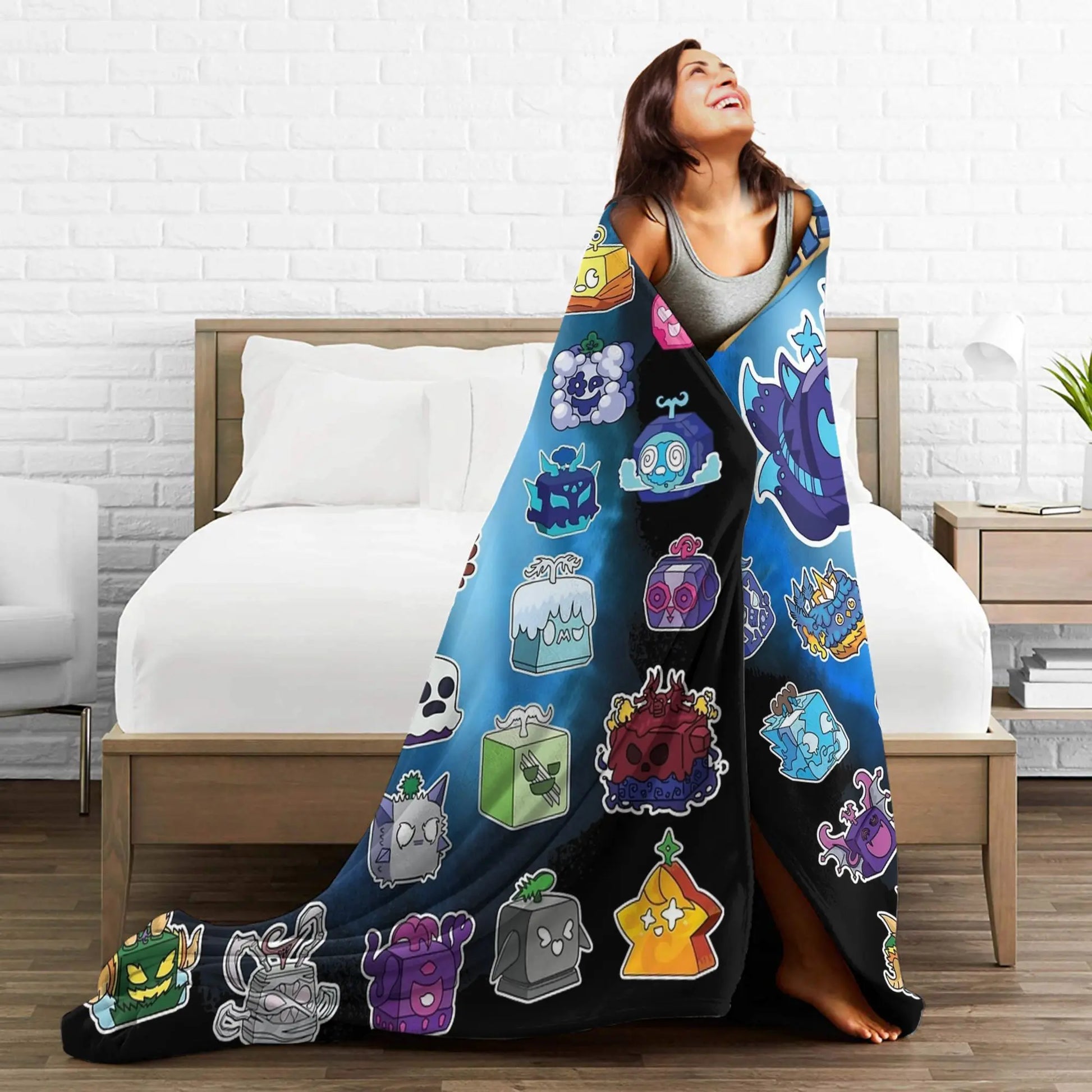 Person wrapped in a colorful blanket with cartoon character designs in a bedroom setting.