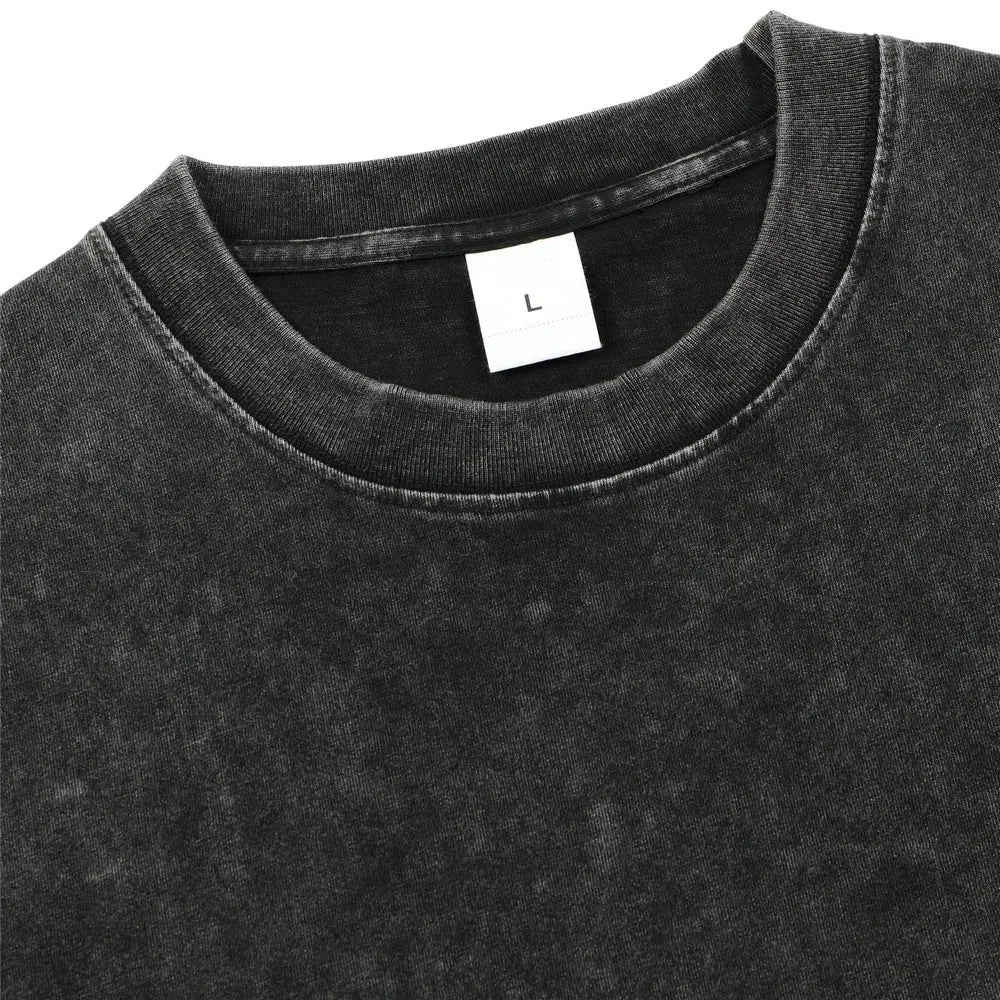Close-up of a black t-shirt with a size label on a white background