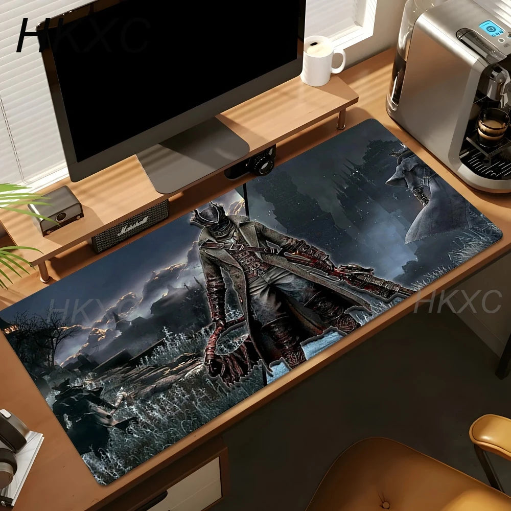 A large desk mat featuring a dark fantasy illustration of a knight in armor, shown on a wooden desk in a home office setting with a computer monitor, coffee machine, and other desk accessories.