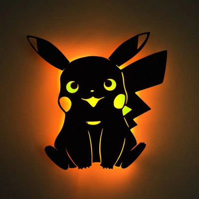 a paper cut of a pikachu sitting in the dark
