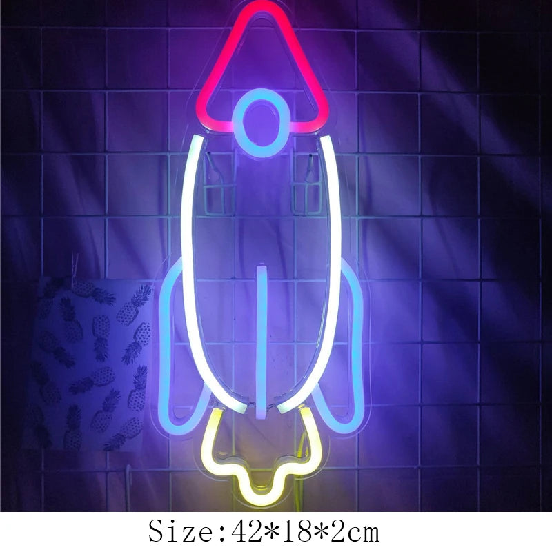 a neon sign with a rocket ship on it
