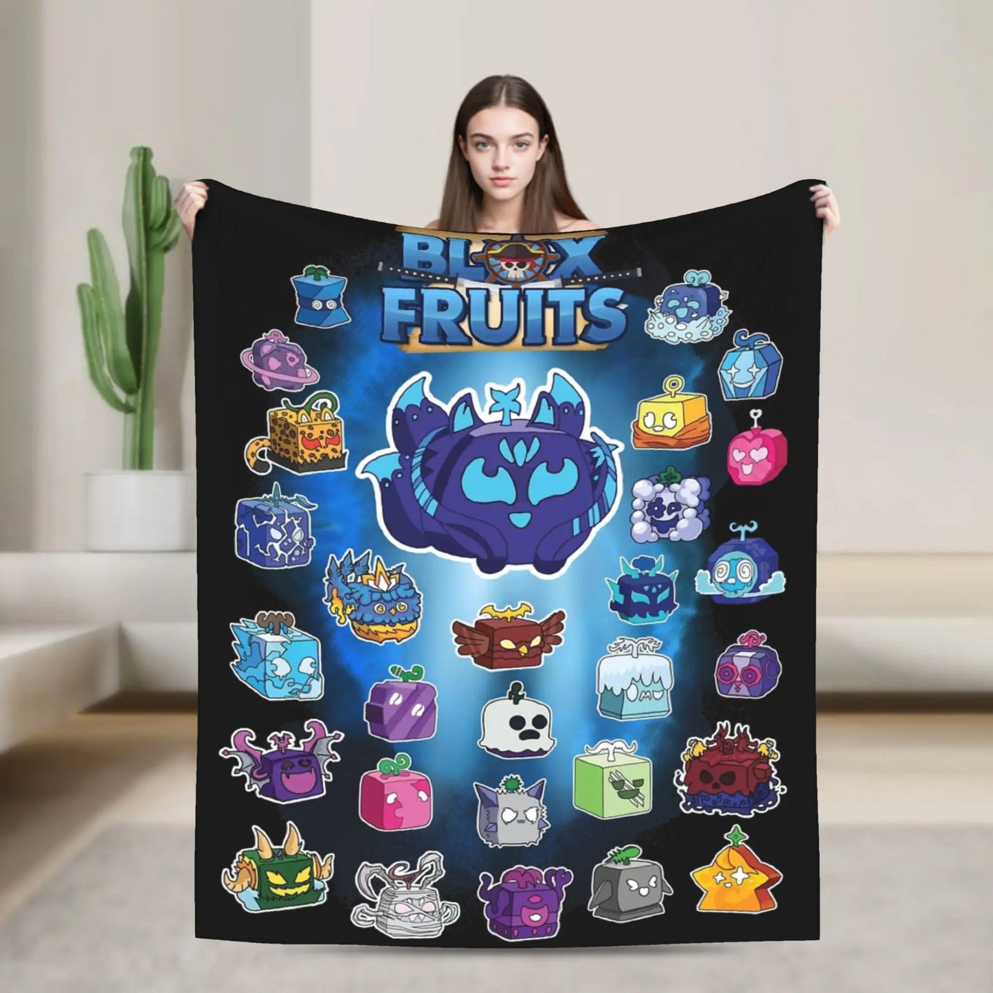 Person holding a blanket with colorful cartoon fruit designs and 'Block Fruits' branding.