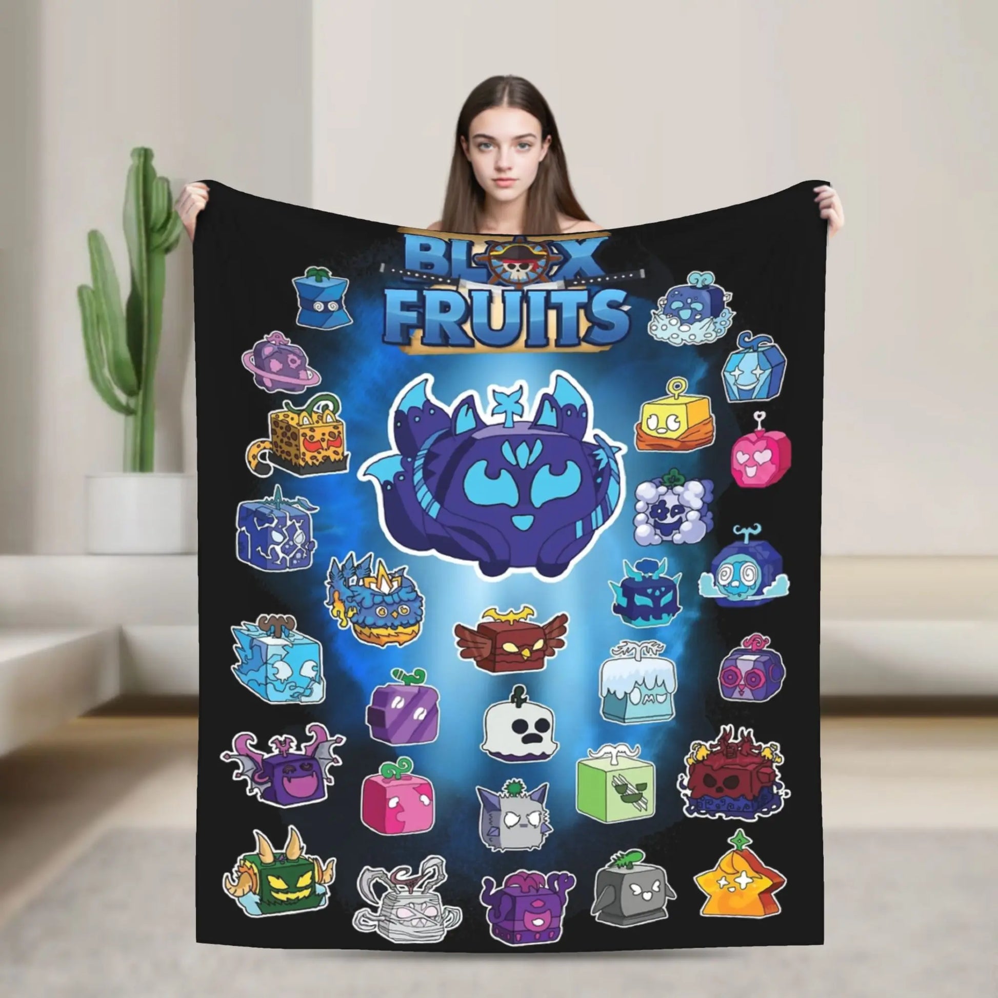 Person holding a blanket with colorful cartoon fruit designs and 'Block Fruits' branding.