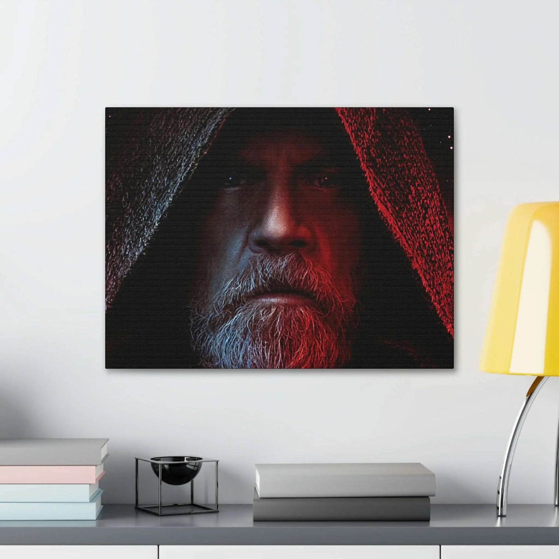 Canvas print featuring Luke Skywalker with a hooded cloak, highlighting his intense expression, displayed on a modern interior wall.